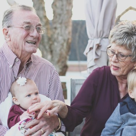 senior couple with grandchildren