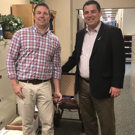 Pandion President, Travis Heider (rt) of Pandion Optimization Alliance works with Pencils and Paper volunteer, Matt Wallace (lt), to donate office supplies.