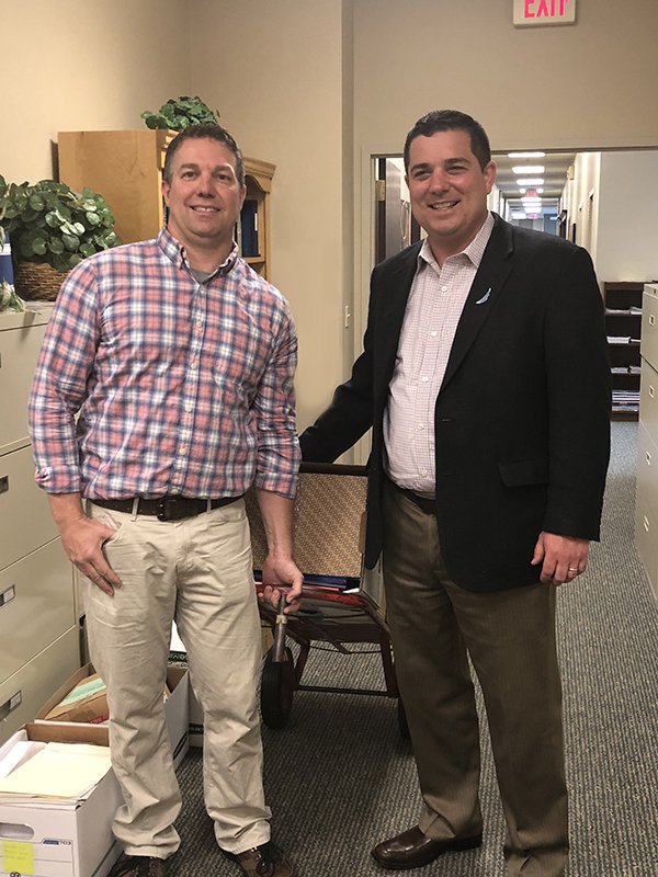 Pandion President, Travis Heider (rt) of Pandion Optimization Alliance works with Pencils and Paper volunteer, Matt Wallace (lt), to donate office supplies.