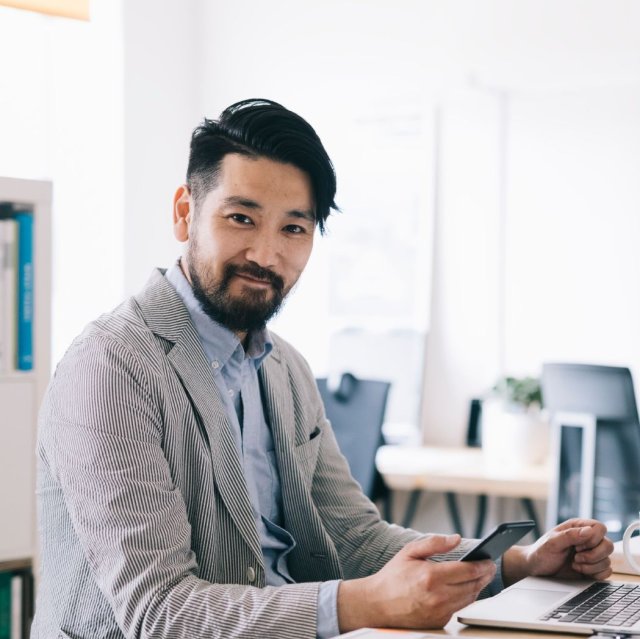 photo of man doing finances