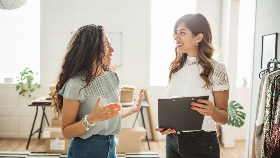 Two small business owners talking